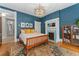 Charming bedroom with a fireplace, hardwood floors, and stylish decor at 1154 N Clarkson St, Denver, CO 80218