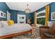 A beautiful main bedroom with a large window and fireplace, bathed in natural light at 1154 N Clarkson St, Denver, CO 80218