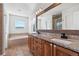 Bathroom with granite countertop and soaking tub at 12773 E 105 Th Pl, Commerce City, CO 80022