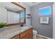 Bathroom with granite countertop and updated vanity at 12773 E 105 Th Pl, Commerce City, CO 80022