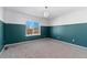 Spacious bedroom with teal walls and plush carpeting at 12773 E 105 Th Pl, Commerce City, CO 80022