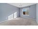 Bright bedroom with gray walls and neutral carpeting at 12773 E 105 Th Pl, Commerce City, CO 80022