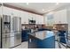 Updated kitchen with dark blue cabinets and quartz countertops at 12773 E 105 Th Pl, Commerce City, CO 80022