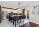 Modern kitchen with brick accent wall and stainless steel appliances at 12773 E 105 Th Pl, Commerce City, CO 80022