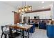 Stylish kitchen featuring a barn door and eat-in island at 12773 E 105 Th Pl, Commerce City, CO 80022