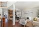 Bright living room with hardwood floors and ample natural light at 12773 E 105 Th Pl, Commerce City, CO 80022