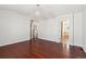 Main bedroom with hardwood floors and ensuite access at 12773 E 105 Th Pl, Commerce City, CO 80022