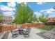 Backyard patio with fire pit and seating area at 12773 E 105 Th Pl, Commerce City, CO 80022