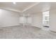 Unfinished basement featuring carpet, neutral walls, support beams, and bathroom at 13457 Glen Cir, Broomfield, CO 80020