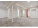Unfinished basement featuring carpet, neutral walls, and white support beams at 13457 Glen Cir, Broomfield, CO 80020