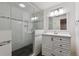 Modern bathroom features a glass shower enclosure and stylish vanity with contemporary fixtures at 13457 Glen Cir, Broomfield, CO 80020
