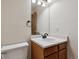 Cozy half-bath featuring a pedestal sink and neutral decor at 13457 Glen Cir, Broomfield, CO 80020