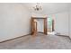 Carpeted bedroom featuring a chandelier and open doorway at 13457 Glen Cir, Broomfield, CO 80020