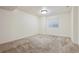 A carpeted bedroom with a window allowing natural light to brighten the space at 13457 Glen Cir, Broomfield, CO 80020