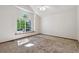 Bright bedroom featuring a large window and plush carpeting at 13457 Glen Cir, Broomfield, CO 80020