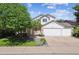 Charming two-story home featuring a three car garage and well-maintained landscaping at 13457 Glen Cir, Broomfield, CO 80020