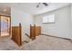 Hallway with wood railing leading to the carpeted floor of the second story at 13457 Glen Cir, Broomfield, CO 80020