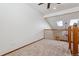 Hallway featuring carpeted floors and skylights that allow plenty of natural light to brighten the space at 13457 Glen Cir, Broomfield, CO 80020