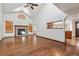 Sunlit living room featuring a fireplace and wood floors at 13457 Glen Cir, Broomfield, CO 80020