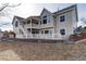 Rear view of the home featuring a deck and backyard at 3430 Deer Creek Dr, Parker, CO 80138