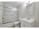 Bathroom featuring glass door shower, toilet, mirror and sink at 2659 S Halifax St, Aurora, CO 80013