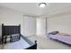 Bedroom featuring carpet, two beds, closet and doorway at 2659 S Halifax St, Aurora, CO 80013