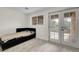 Bedroom with carpet, window and glass paneled doors to the backyard at 2659 S Halifax St, Aurora, CO 80013