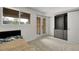 Bedroom with carpet, window, glass paneled doors and closet at 2659 S Halifax St, Aurora, CO 80013