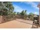 Deck with wood railings and a grill overlooking treetops at 2659 S Halifax St, Aurora, CO 80013