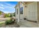 View of the front porch with well-manicured garden, covered entryway, and detailed trim at 2659 S Halifax St, Aurora, CO 80013