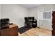 Bright home office with hardwood floors, a modern desk setup, and natural light from a window at 2659 S Halifax St, Aurora, CO 80013