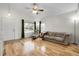 Inviting living room with hardwood floors, large windows, and comfortable seating area at 2659 S Halifax St, Aurora, CO 80013