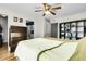 Spacious main bedroom with wood floors, ceiling fan, and ample storage space at 2659 S Halifax St, Aurora, CO 80013