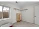 Room with carpet, a window, a wooden shelf and wall shelves at 2659 S Halifax St, Aurora, CO 80013