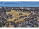 An aerial view shows a spacious park with walking trails, trees and cityscape in the distance on a sunny day at 1100 N Marion St # 4, Denver, CO 80218