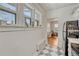 Natural light floods this kitchen, highlighting the checkerboard floors at 1100 N Marion St # 4, Denver, CO 80218