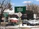 Exterior shot of Whole Foods Market with street signs and parked cars nearby at 1100 N Marion St # 4, Denver, CO 80218