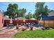 Landscaped backyard with patio, seating, and umbrellas at 1800 S Sherman St, Denver, CO 80210