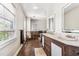 Bathroom with double vanity, tile flooring and shower at 1800 S Sherman St, Denver, CO 80210