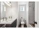 Clean bathroom with double vanity, shower, and toilet at 1800 S Sherman St, Denver, CO 80210