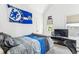 Cozy bedroom with a full-size bed, and a wall mounted TV at 1800 S Sherman St, Denver, CO 80210