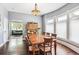 Bright dining room with a view of the living room and kitchen at 1800 S Sherman St, Denver, CO 80210