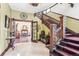 Elegant entryway with hardwood floors and a grand staircase at 1800 S Sherman St, Denver, CO 80210