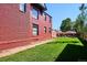 Brick building with side yard and green lawn at 1800 S Sherman St, Denver, CO 80210