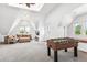 Spacious game room with foosball table and comfortable seating at 1800 S Sherman St, Denver, CO 80210