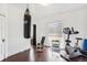 Home gym with exercise bike, weights, and punching bag at 1800 S Sherman St, Denver, CO 80210