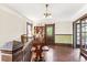 Upper floor landing with hardwood floors, built-in shelves, and access to balcony at 1800 S Sherman St, Denver, CO 80210