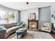 Spacious living room with fireplace and bay windows at 1800 S Sherman St, Denver, CO 80210