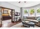 Living room with comfy seating, a large TV and access to other rooms at 1800 S Sherman St, Denver, CO 80210
