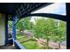 View from the porch showcasing tree-lined street and yard at 1800 S Sherman St, Denver, CO 80210